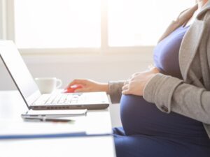 pregnant-woman-is-working-on-computer-laptop-and-mobile-phone-business