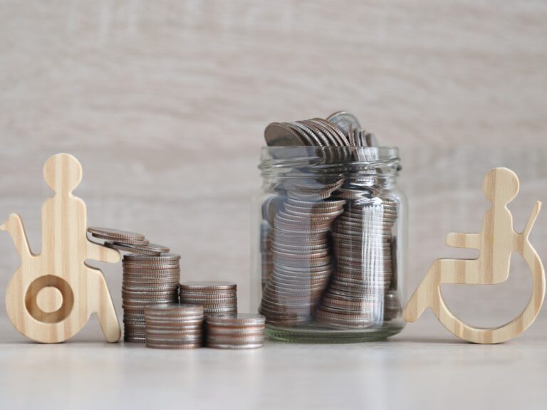 man-on-wheelchair-and-coin-money-in-the-glass-bottle-on-wooden-background-save-money-for Safeguarding Your Firm: Why Disability Insurance is Important for Small Law Practices