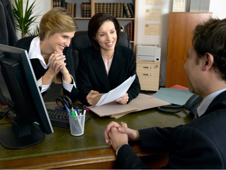 business-manager-with-client Why Legal Project Management Is Essential for Flat Fee Success