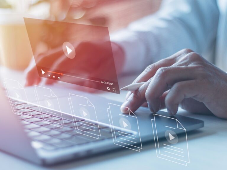 businessman-hands-using-laptops-for-streaming-online-on-virtual-screens-watching-videos-on Why Video Marketing for Law Firms Matters