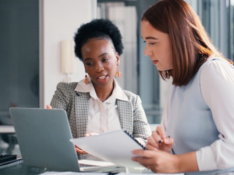 paper-laptop-and-people-in-office-for-meeting-financial-planning-and-business-discussion Choosing the Right Legal Staffing Partner